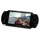 Sony psp handheld game console displaying a racing game with a red car on screen.