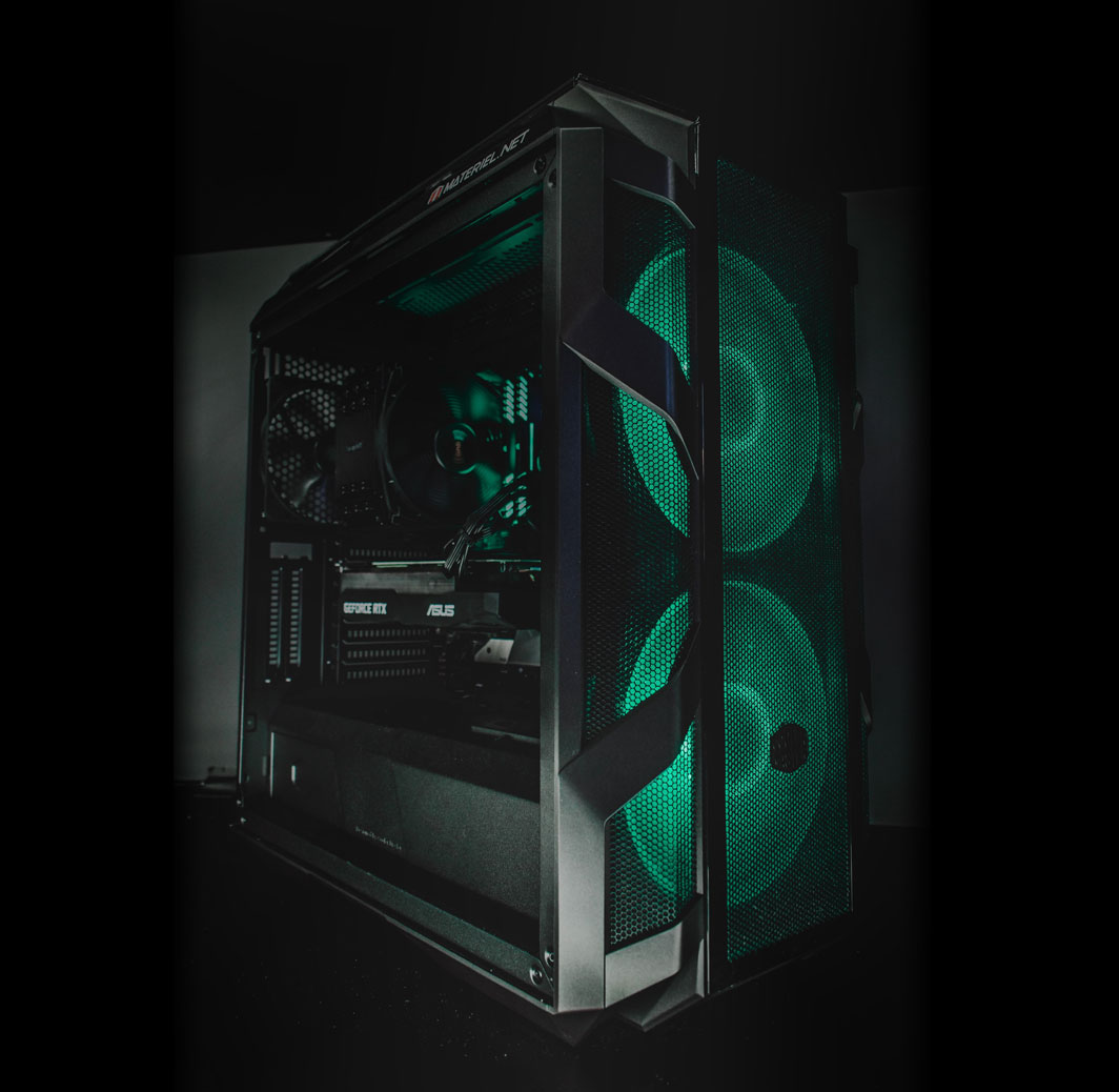 High-performance gaming computer with illuminated green fans and a clear side panel, optimized for emulators and demanding builds.